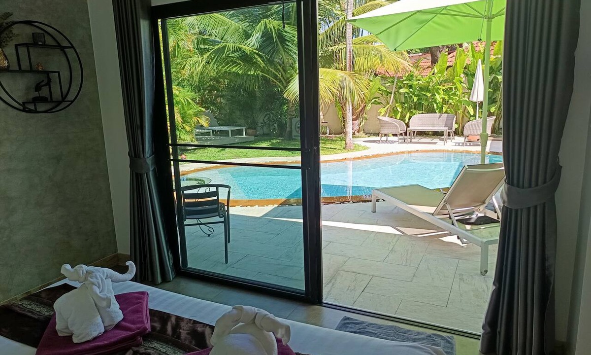 Rawai Villa | Paradise Island Villa 3 features a private swimming pool in a luxurious tropical park.