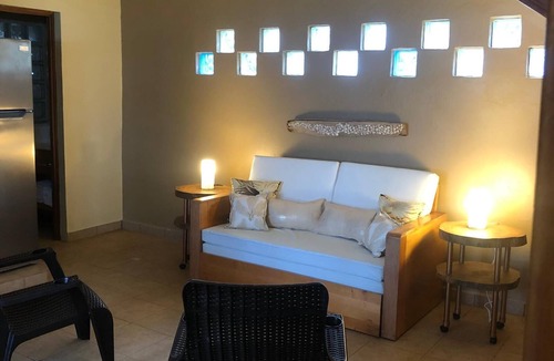 Corn Island House | 2 story home on beach, large breezy veranda for seamless indoor, outdoor living.