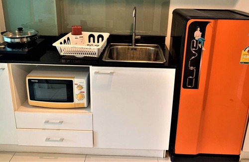 Wichit Apartment | Cozy Pool view Studio Suite | Kitchen | Balcony