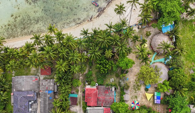 Experience serene sunsets, private beach access, and tropical luxury in this renovated Thai house.