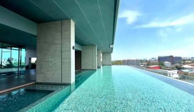 Modern 1-bedroom condo for up to 2 guests at Amber by Ester Star. Includes a separate bedroom, living area, kitchen, dining space, washing machine, balcony, city view and access to pool, gym, co-working space and shared building amenities.