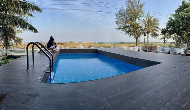 Traditional Northern Thai beach house with a swimming pool