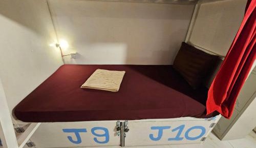 Single Bed in Dormitory Room