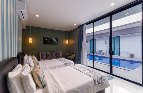 Si Sunthon Villa | Lespalm Resort by Vacayandco