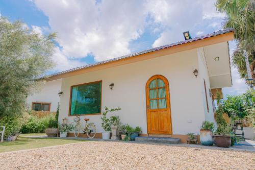 Three Neem Trees House
